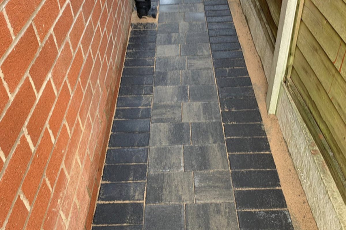 Block paved path down the side of a house