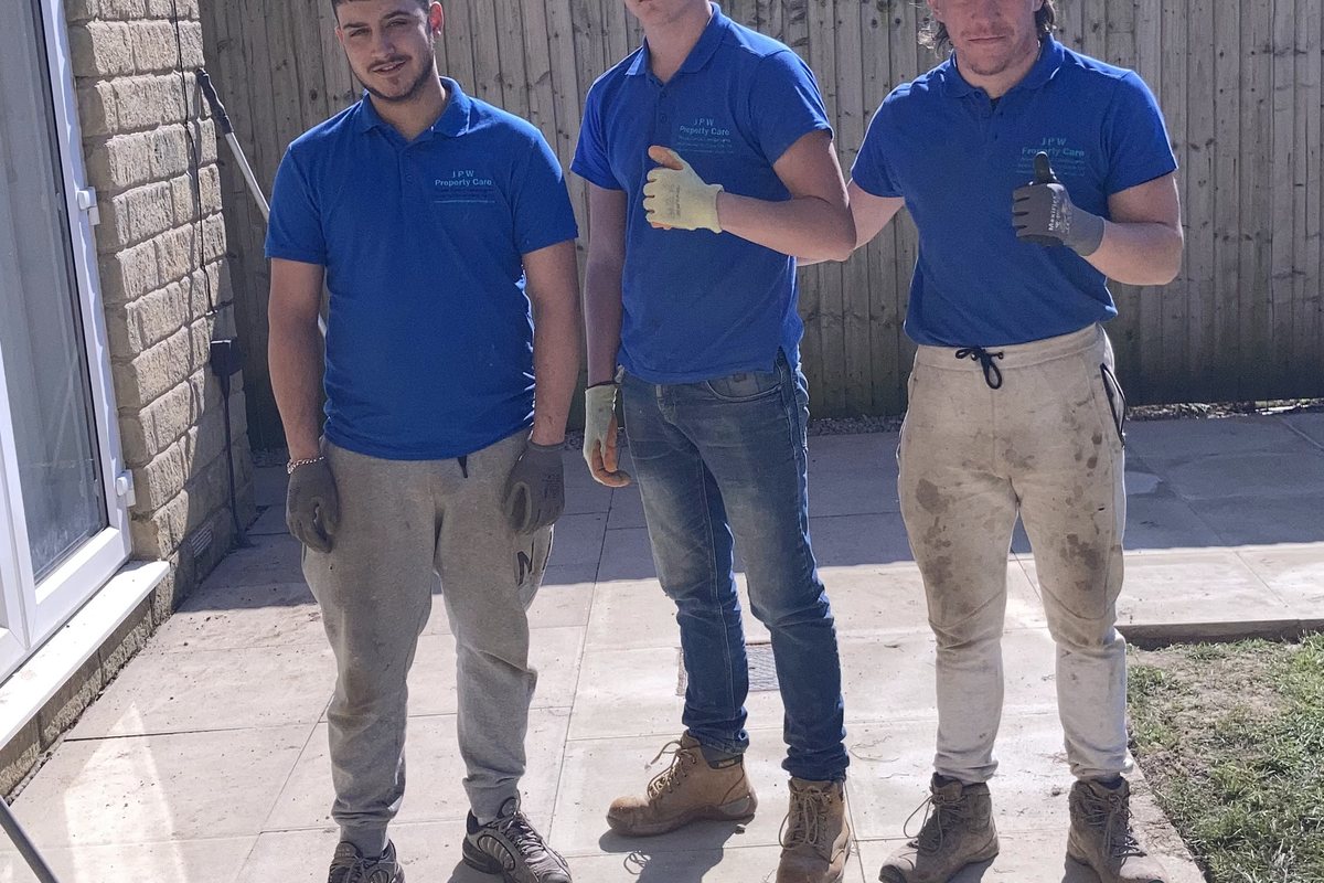 The team on a newly laid patio